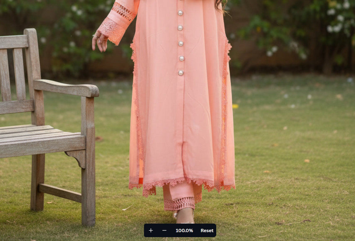 Girl wearing a peach-colored traditional outfit standing on grass next to a wooden bench
