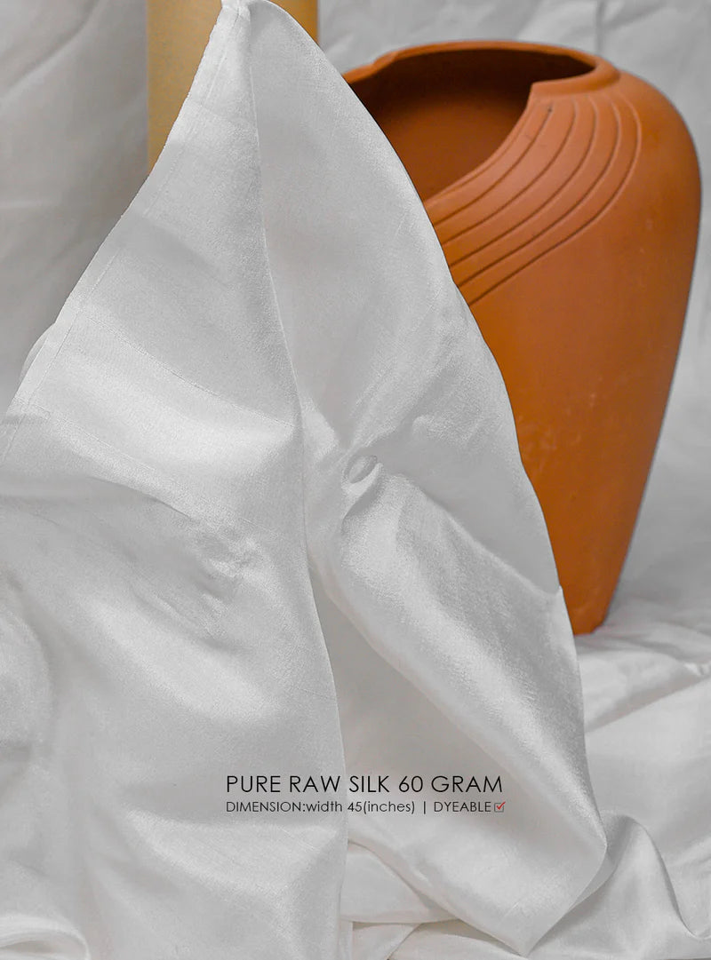 White fabric with a terracotta pot in the background